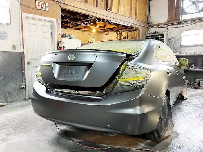 PREMIERE AUTO BODY REPAIR INC 1